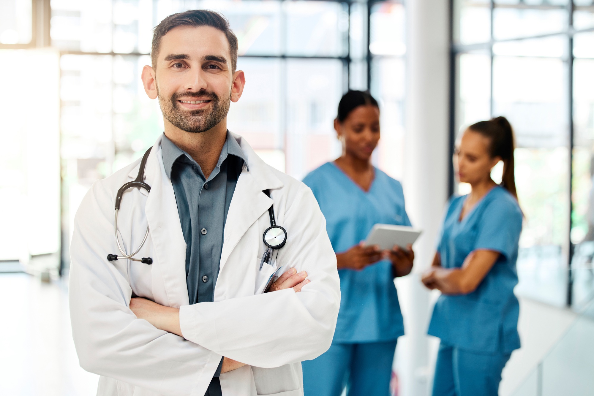 Doctor, leadership or healthcare employee with smile in hospital for vision, motivation or mission
